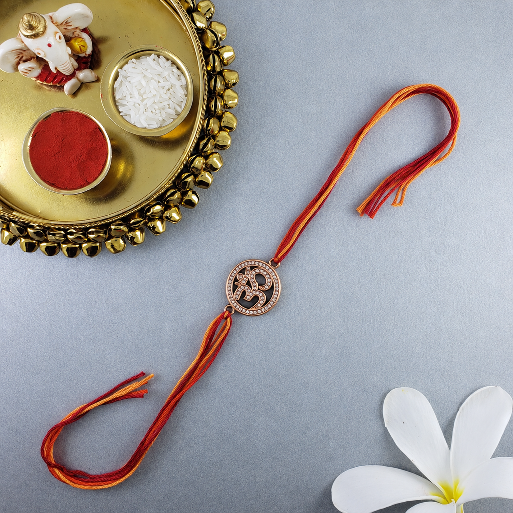 Om Symbol Rose Gold Plated CZ Red Orange Thread Rakhi For Men Wholesale