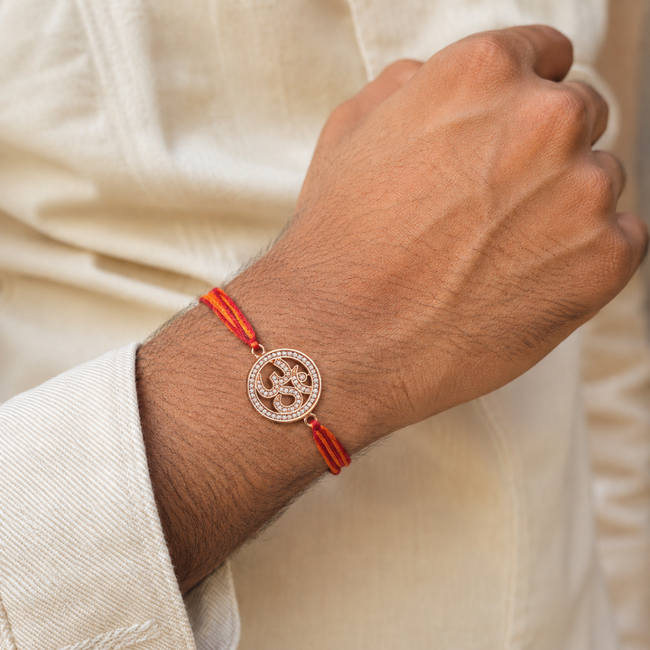 Om Symbol Rose Gold Plated CZ Red Orange Thread Rakhi For Men Wholesale Main image