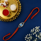 Oval Evil Eye Gold Plated CZ Red Orange Thread Rakhi For Men Wholesale