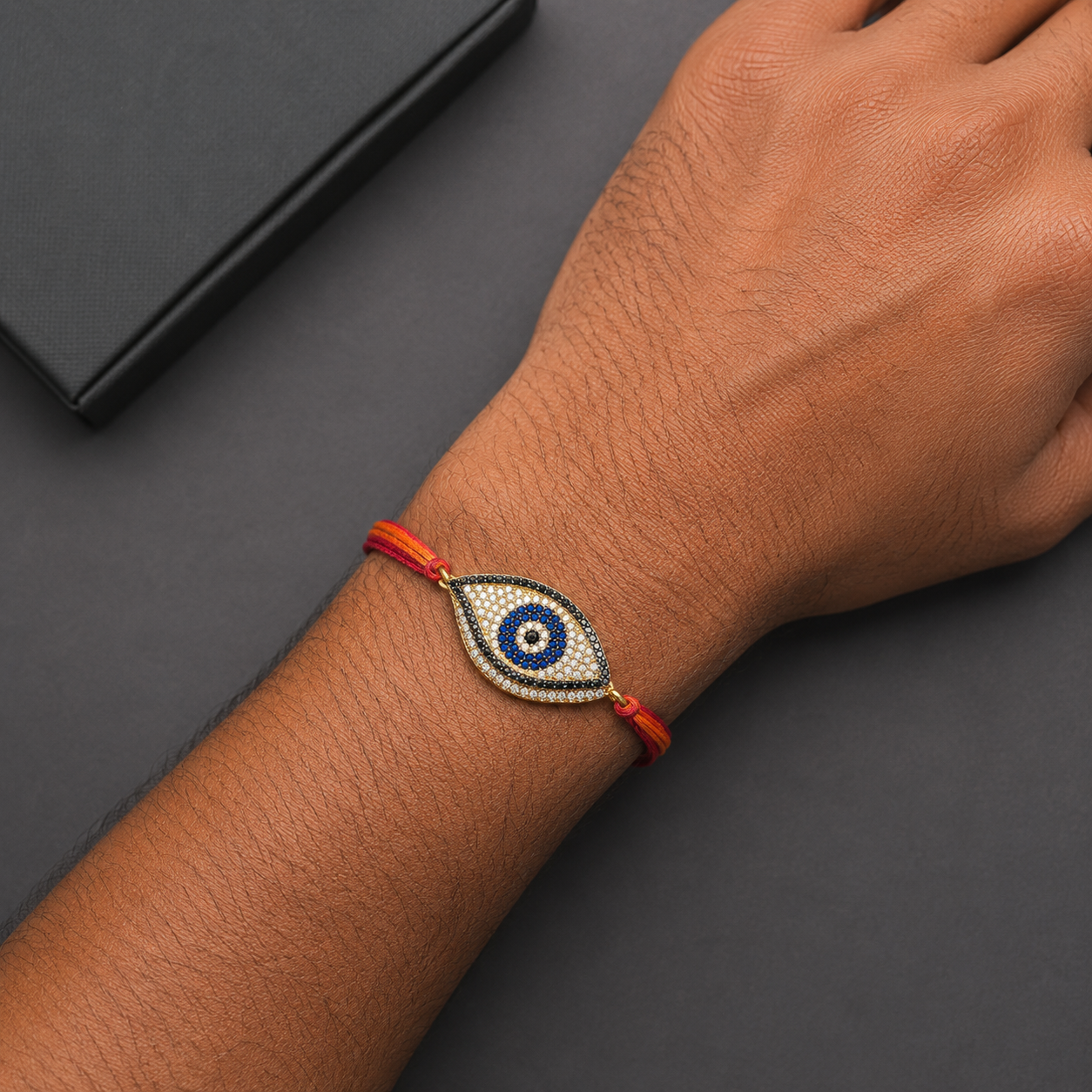 Designer Oval Evil Eye Black CZ Red Orange Thread Rakhi For Men Bulk