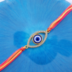 Oval Evil Eye Gold Plated CZ Red Orange Thread Rakhi For Men Wholesale