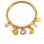 Gold-plated adjustable bangle bracelet with multiple charms including a star, sun, lips, crescent moon, pearl, and disc, shown with dimension markings of 6.0cm width and 0.